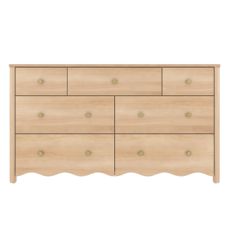 Light natural wood dresser with multiple drawers, round brass knobs and scalloped base — modern farmhouse bedroom storage