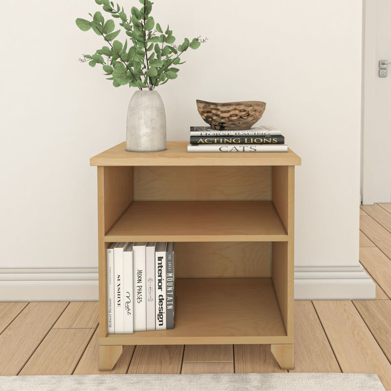 Wooden side table with decorative vase and books for modern home decor.
