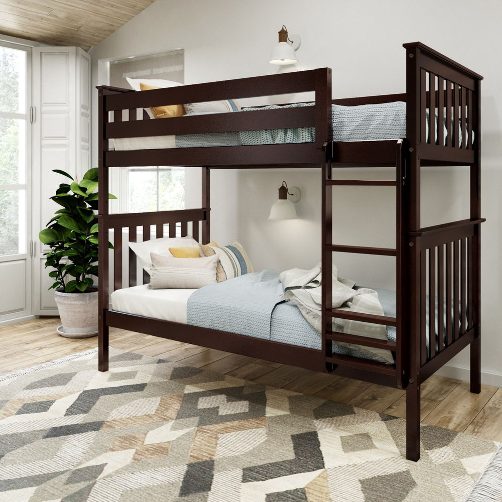 Dark wood bunk bed in a bright bedroom with modern decor and geometric rug.