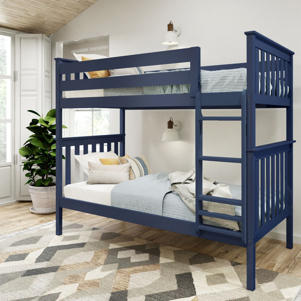 Navy blue bunk bed in modern bedroom with decorative pillows and cozy bedding.
