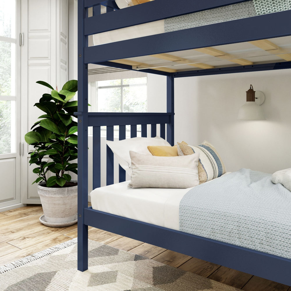 Modern blue bunk bed in cozy bedroom with stylish bedding and indoor plant.