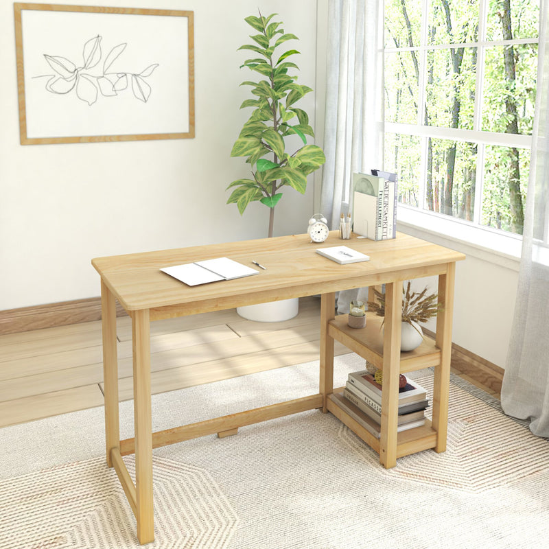 Wooden desk in bright home office with large window, indoor plant, and decorative artwork.