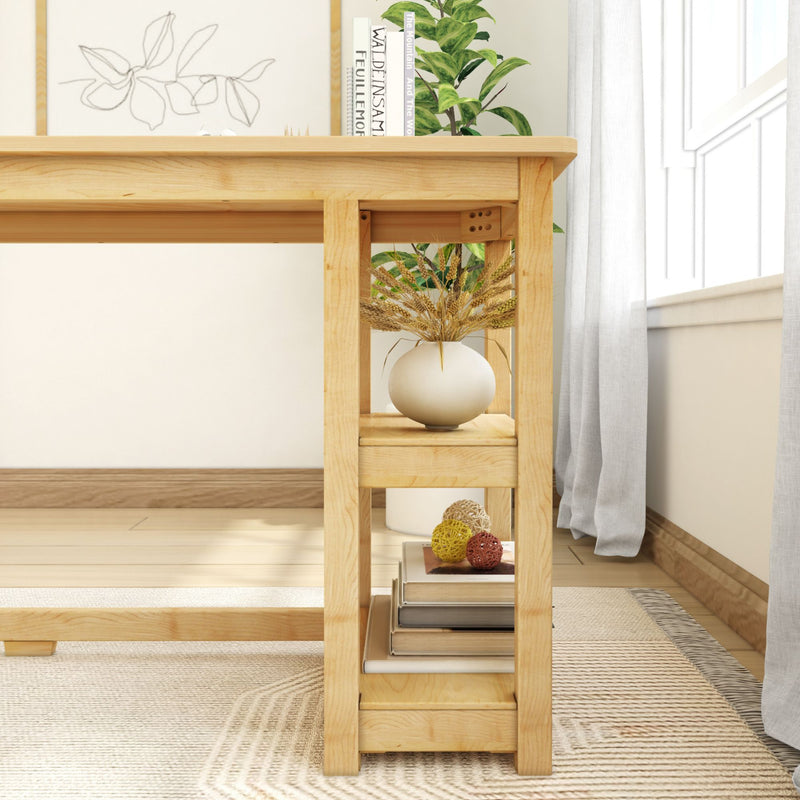 Minimalist wooden desk with modern decor, white vase with wheat stalks, books, and woven rug in bright room.