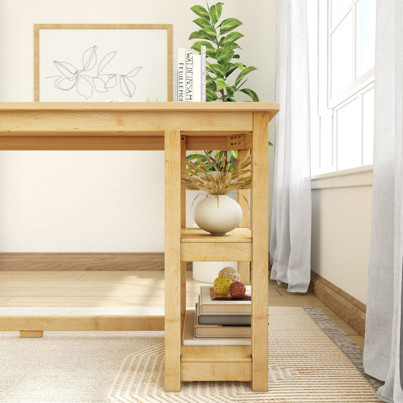 Minimalist wooden desk with decorative shelves featuring a white vase, books, and green plant near a sunlit window.