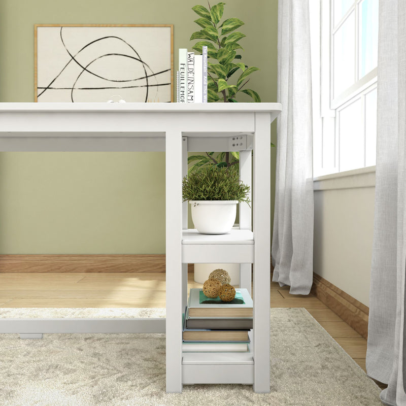 Modern home office desk with shelf, potted plant, and books for stylish workspace organization.