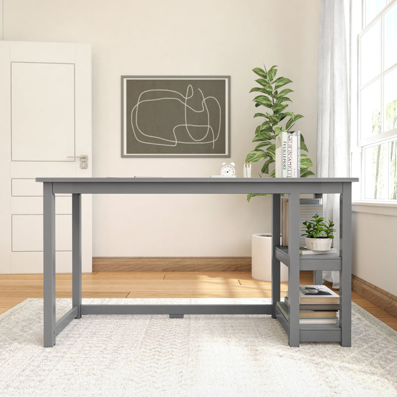 Modern home office with gray desk, abstract wall art, and indoor plant for a minimalistic workspace setup.