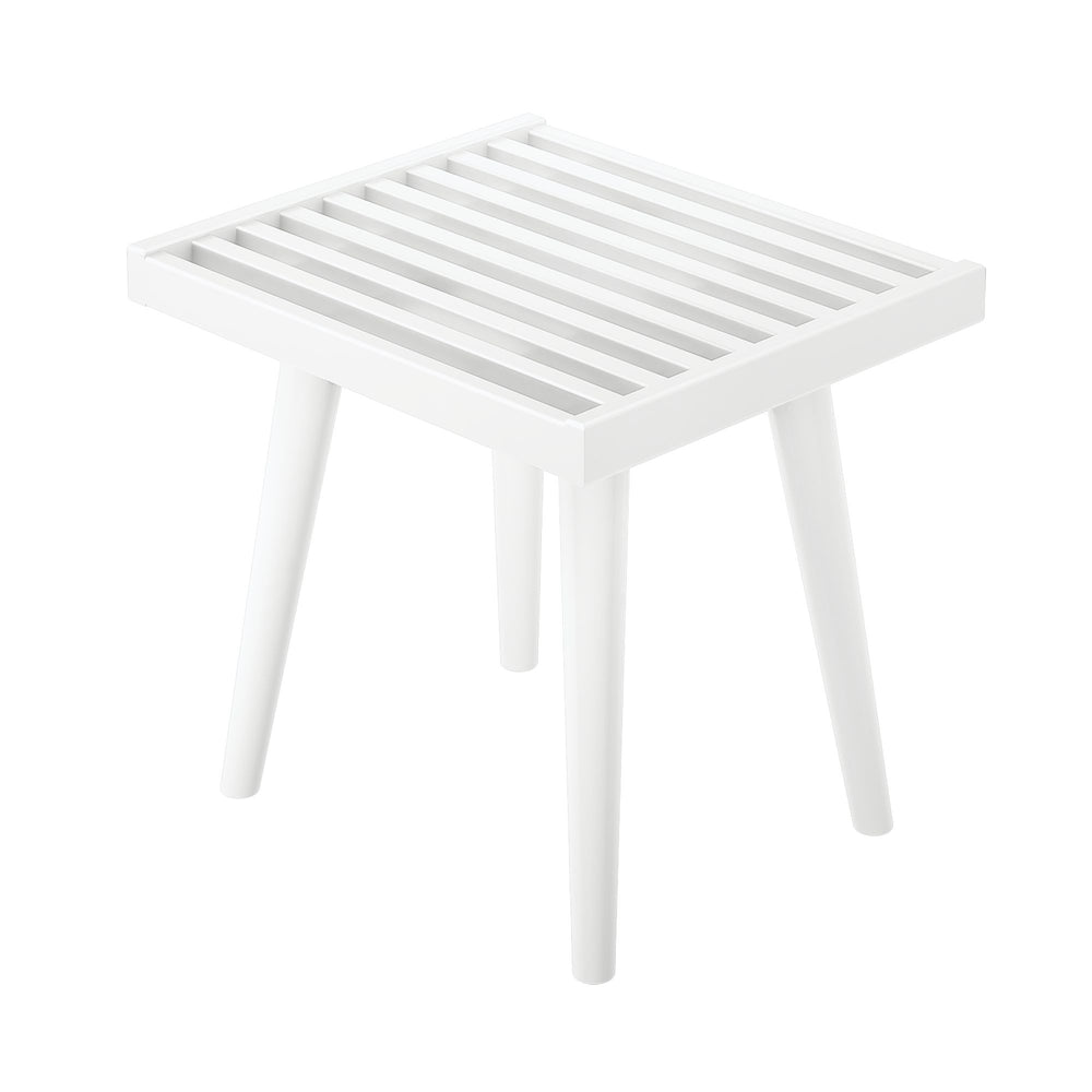 White slatted wooden side table with four legs, modern minimalist design.