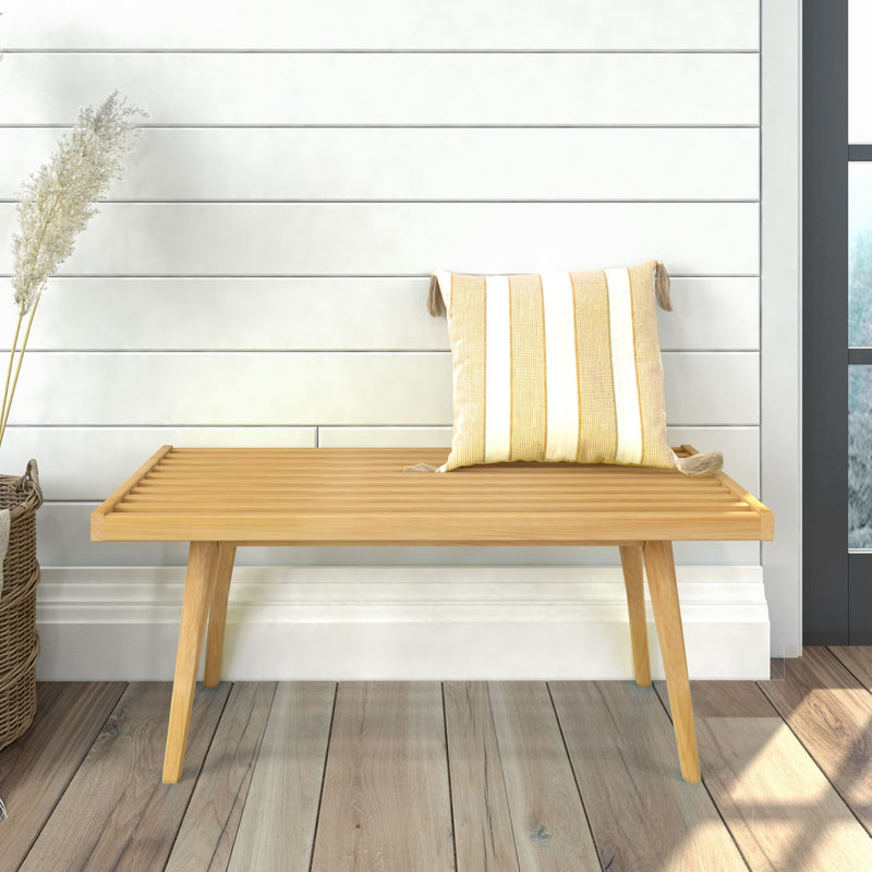 Wooden bench with a striped cushion in a modern interior setting.