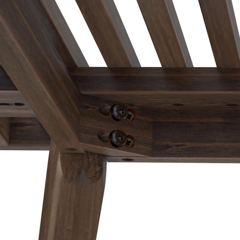 Close-up of wooden furniture joint with screws showing detailed craftsmanship.