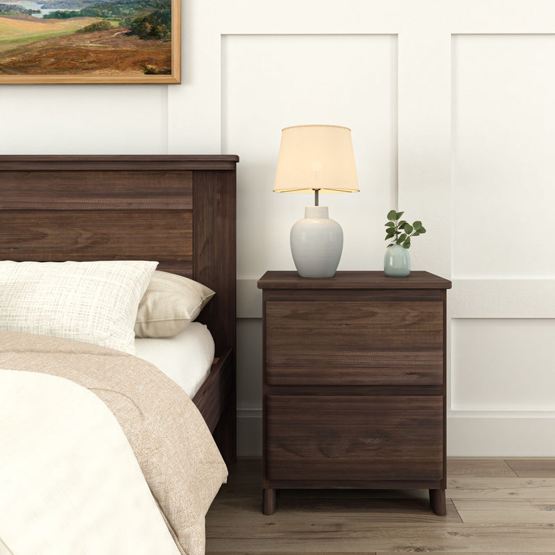 Dark wood bedroom set with elegant nightstand, table lamp, and modern decor.
