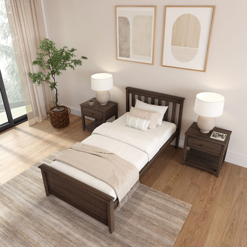 Modern minimalist bedroom with dark wood single bed and matching nightstands, neutral bedding, table lamps, abstract wall art and potted plant on hardwood floor.