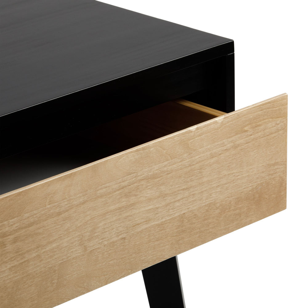 A black and natural wood desk drawer partially open, showcasing modern minimalist design.