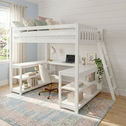 White loft bed with integrated L-shaped desk, ladder and shelves in a bright farmhouse-style kids' study nook with pastel pillows, gold desk lamp and laptop.