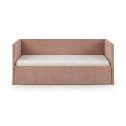 Pink upholstered daybed with high back and side rails, white quilted mattress, modern fabric twin sofa bed on white background