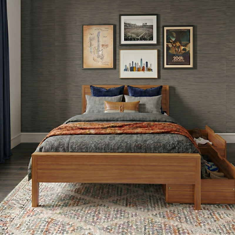 Modern bedroom with wooden bed frame, cozy layered bedding, gray textured wallpaper, framed gallery wall art and under-bed shoe storage