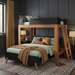 Modern wooden loft bunk bed with ladder, mint-green bedding, layered pillows and tan knit throw against a dark paneled accent wall — cozy contemporary bedroom decor