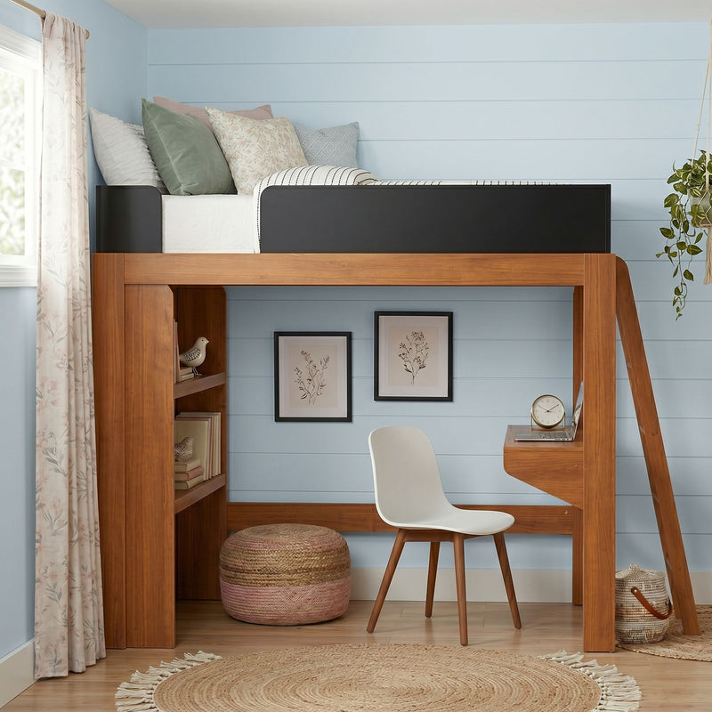 Space-saving wooden loft bed with built-in desk and ladder, blue shiplap wall, white chair, woven rug, pastel pillows, botanical art and hanging plant