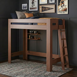 Walnut wooden loft bed with ladder in teen room, navy bedding and leather pillow, skate-themed wall art and built-in shelves