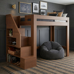 Modern walnut loft bed with staircase and built-in storage shelves, gray textured wall, framed art and striped area rug