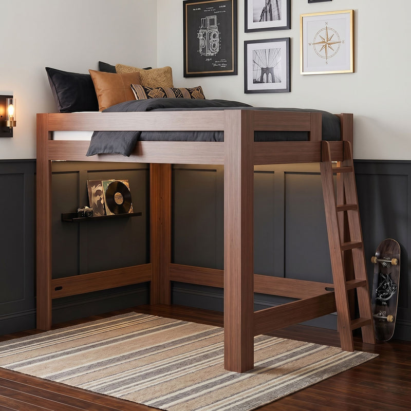 Modern wooden loft bed with ladder in stylish teen bedroom, gray bedding and leather pillows, framed wall art, skateboard and vinyl record decor