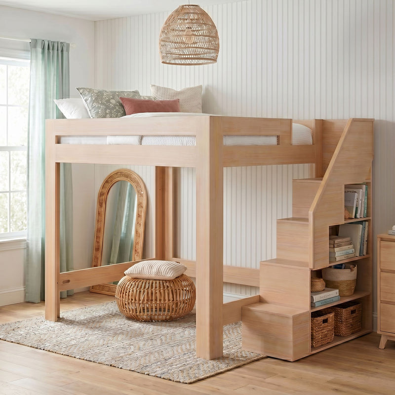 Natural wood loft bunk bed with built-in storage stairs, rattan pendant light, woven pouf, neutral rug and mint curtains in a modern boho kids bedroom with white beadboard wall