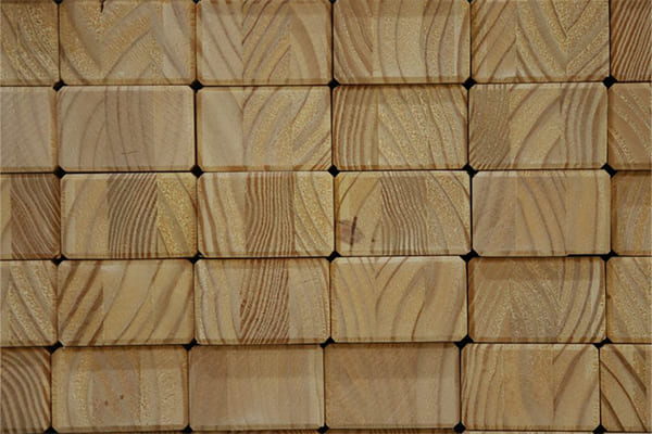 Decorative wooden wall tiles with natural grain pattern texture.